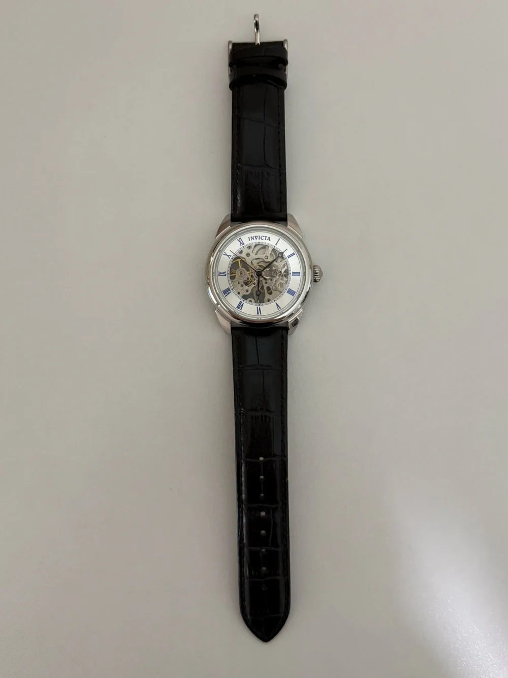 Invicta Men’s Silver Skeleton Dial Watch with Black Leather Strap